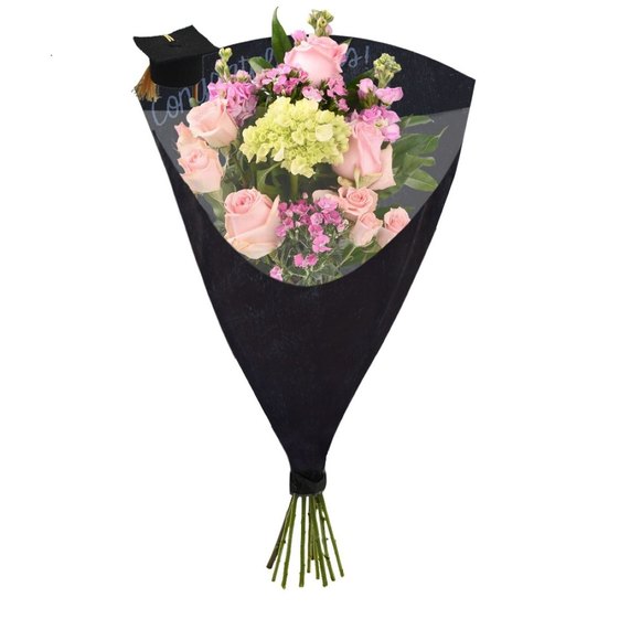 Pink rose and hydrangea graduation bouquet wrapped in black paper with cap accent, celebratory floral gift for graduation.